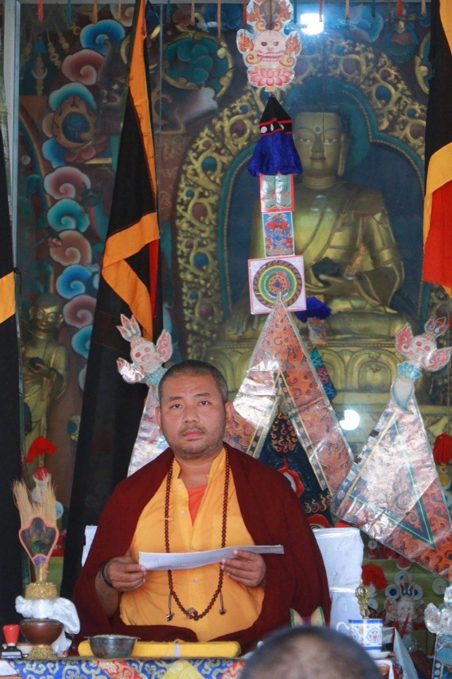 Lama Sonam Tashi Rinpoche teaching in the monastery shrine hall